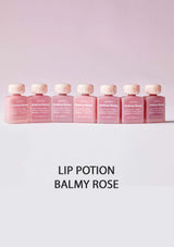 Row of pink lip potion bottles labeled 'Balmy Rose' on a light pink background.