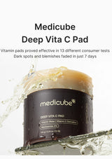 Medicube Deep Vita C Pad with water splash on a white background