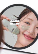 Person applying patches to their face with a magnifying mirror showing 'Butterfly Zone' and 'Pores'.