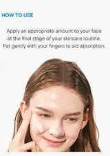 Skincare product application instruction with a woman applying cream to her face.