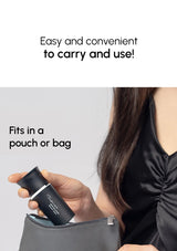 Person holding a small black container with text about ease of use and portability.