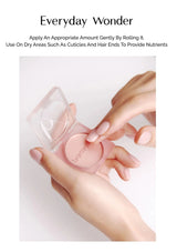 Hand holding a pink skincare product with text on a white background