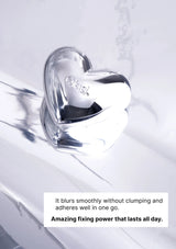 Heart-shaped compact with Olay branding on a white background