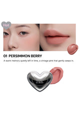 Lipstick with heart-shaped cap on a white background, showing color swatch and close-up of lips.