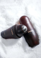 Two brownVarol bottles on a white textured background