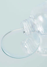 Clear glass suction cup on a light blue background