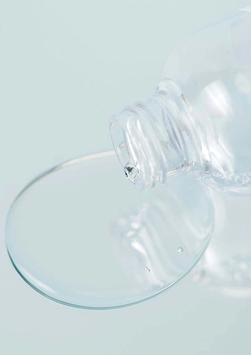 Clear glass suction cup on a light blue background