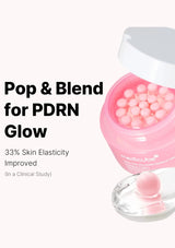 Pink container with pearl-like beads and a spoon on a white background