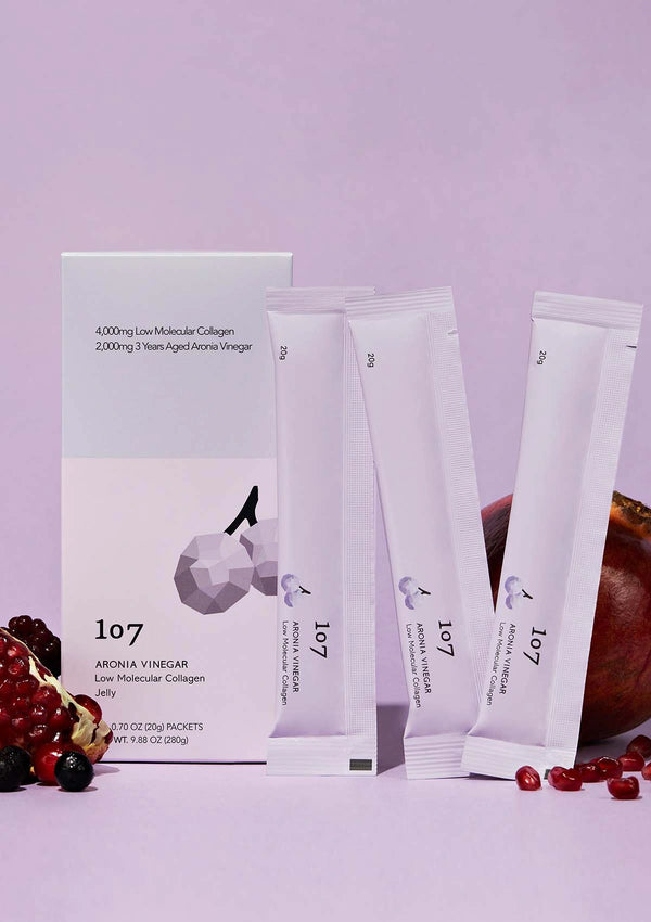 Packaging of 107 Aronia Vinegar with a purple background