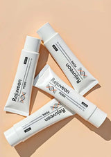 Multiple tubes of Rejuveon product on a beige background