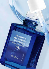 Blue serum bottle with dropper labeled 'Dr. Althea Aqua Marine Deep Serum' on a light blue background.