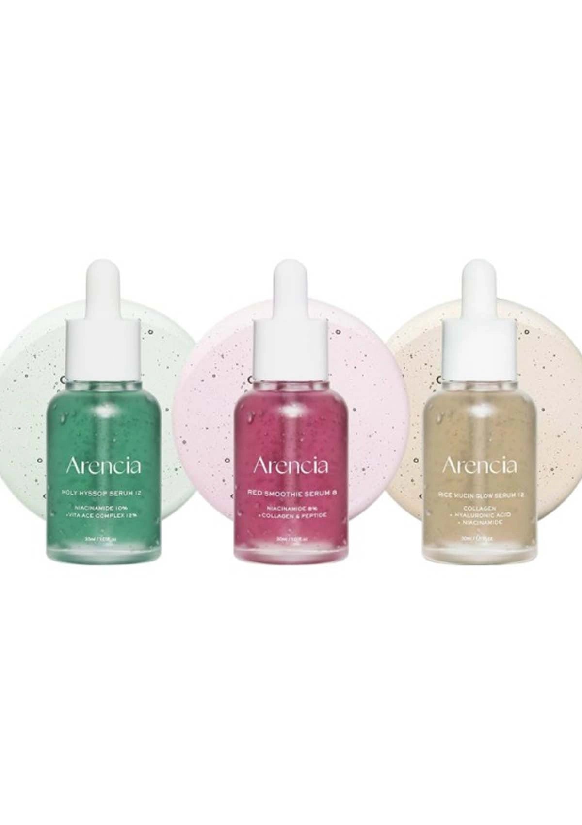 Three bottles of Arencia skincare serum on a white background