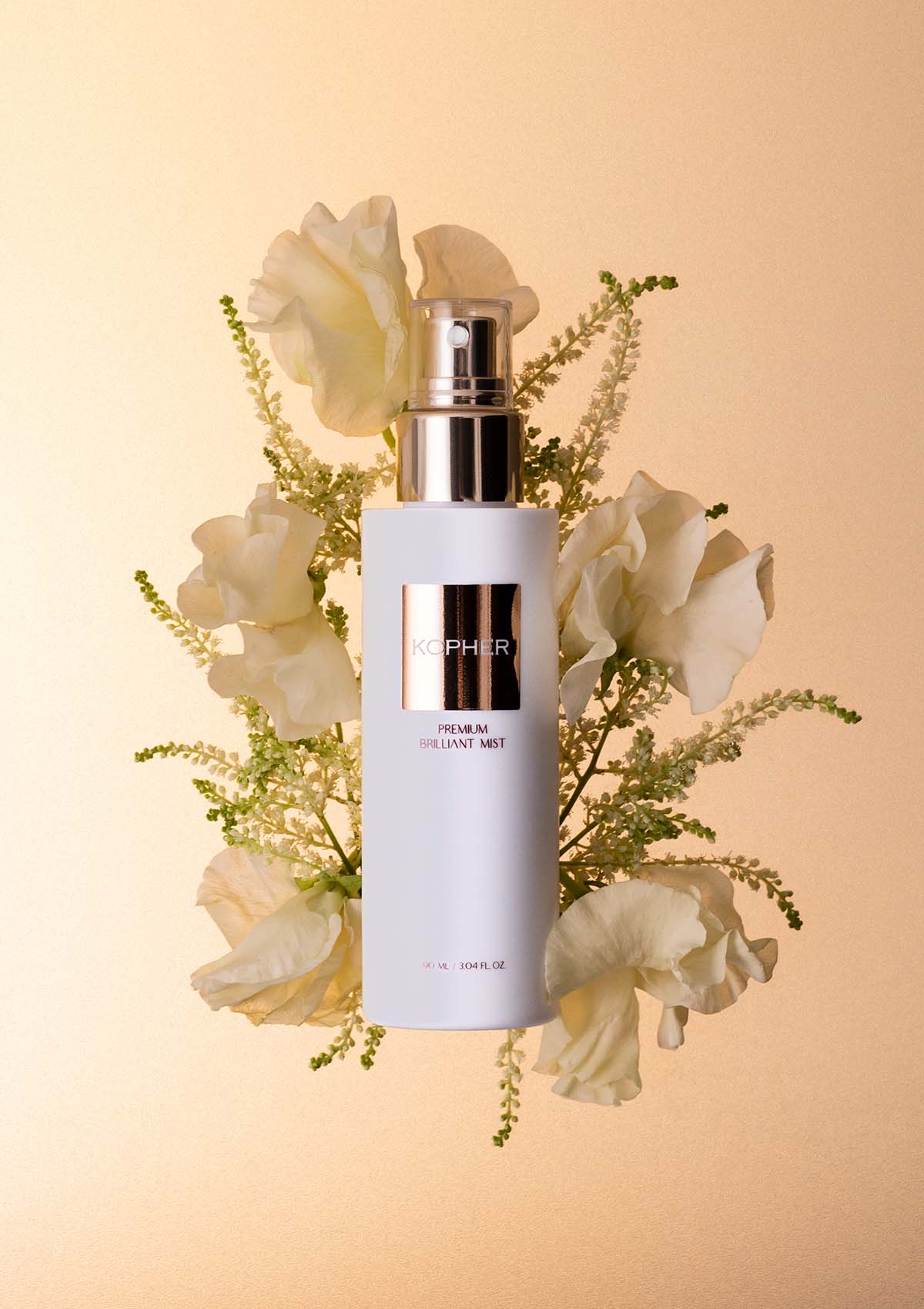 Skincare bottle with flowers on a beige background