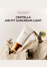 Sunscreen cream tube on a rock with 'Skin1004' branding and product name.