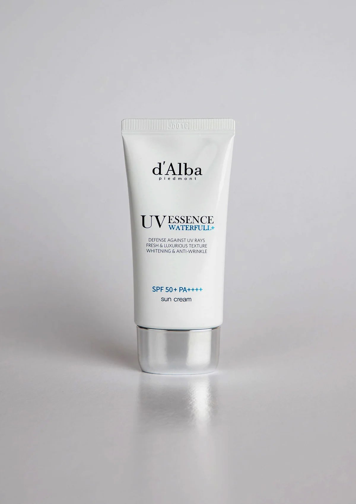 Tube of d'Alba UV Essence Waterfull cream on a white background