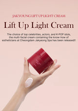 Red jar of Lift Up Light Cream held by a hand with a pink background