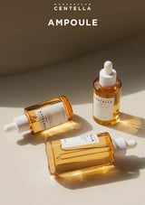 Three bottles of Madagascan Centella Ampoule on a beige background