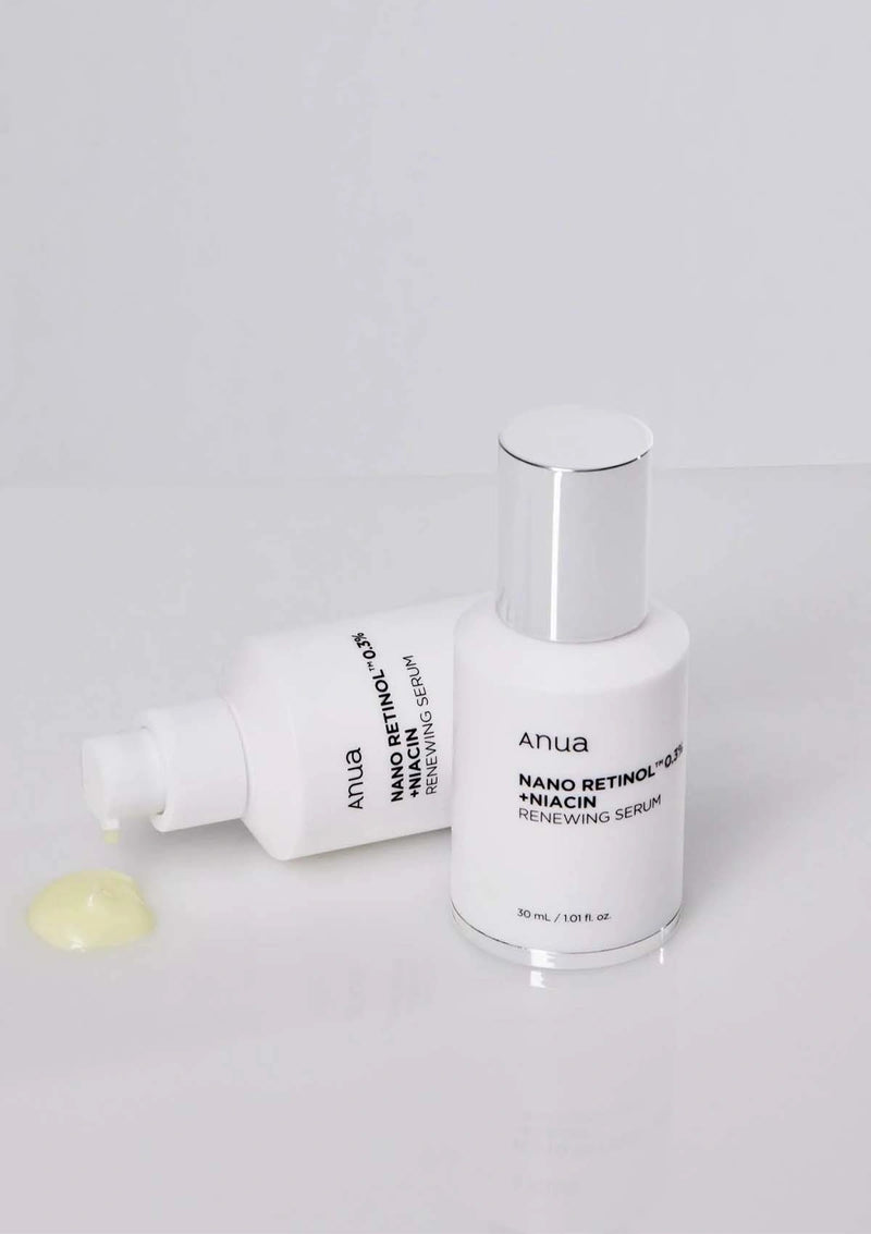 Two skincare products from the brand 'Anua' on a light gray background