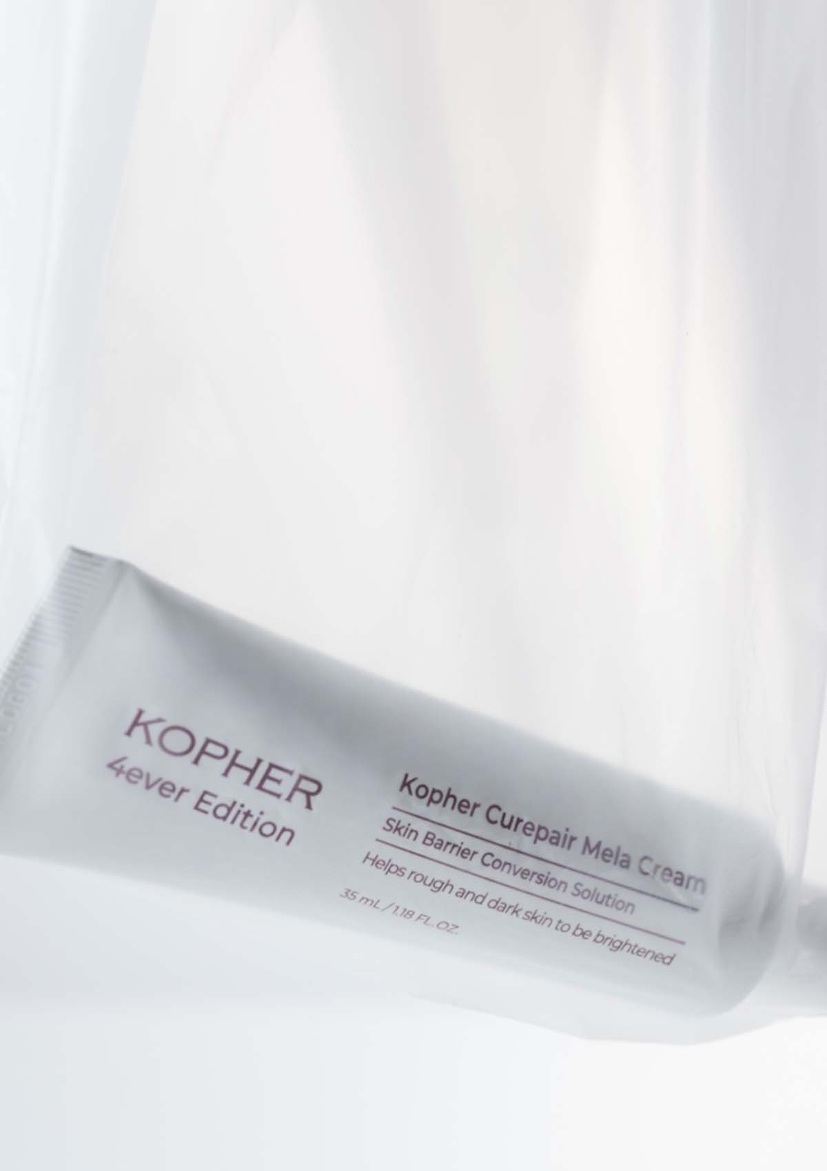 Kopher skincare product packaging on a white background