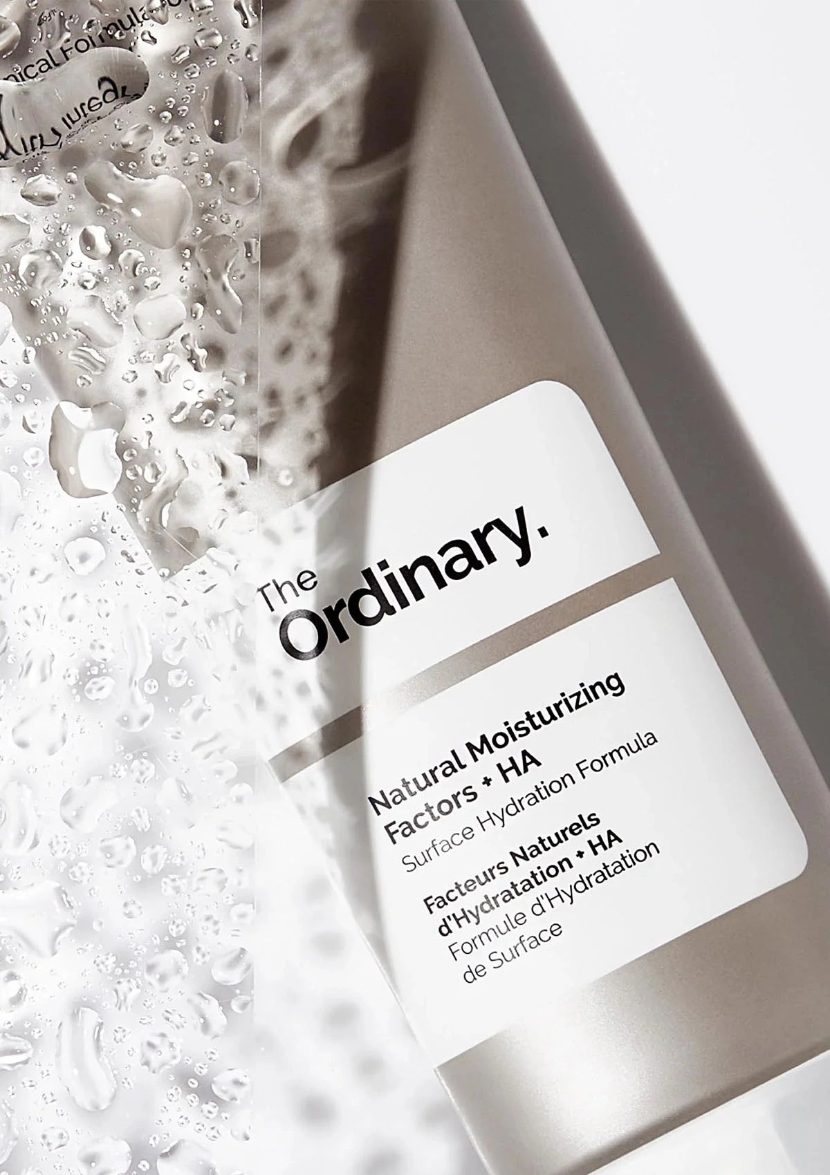 The Ordinary skincare product with a close-up of bubbles in the background