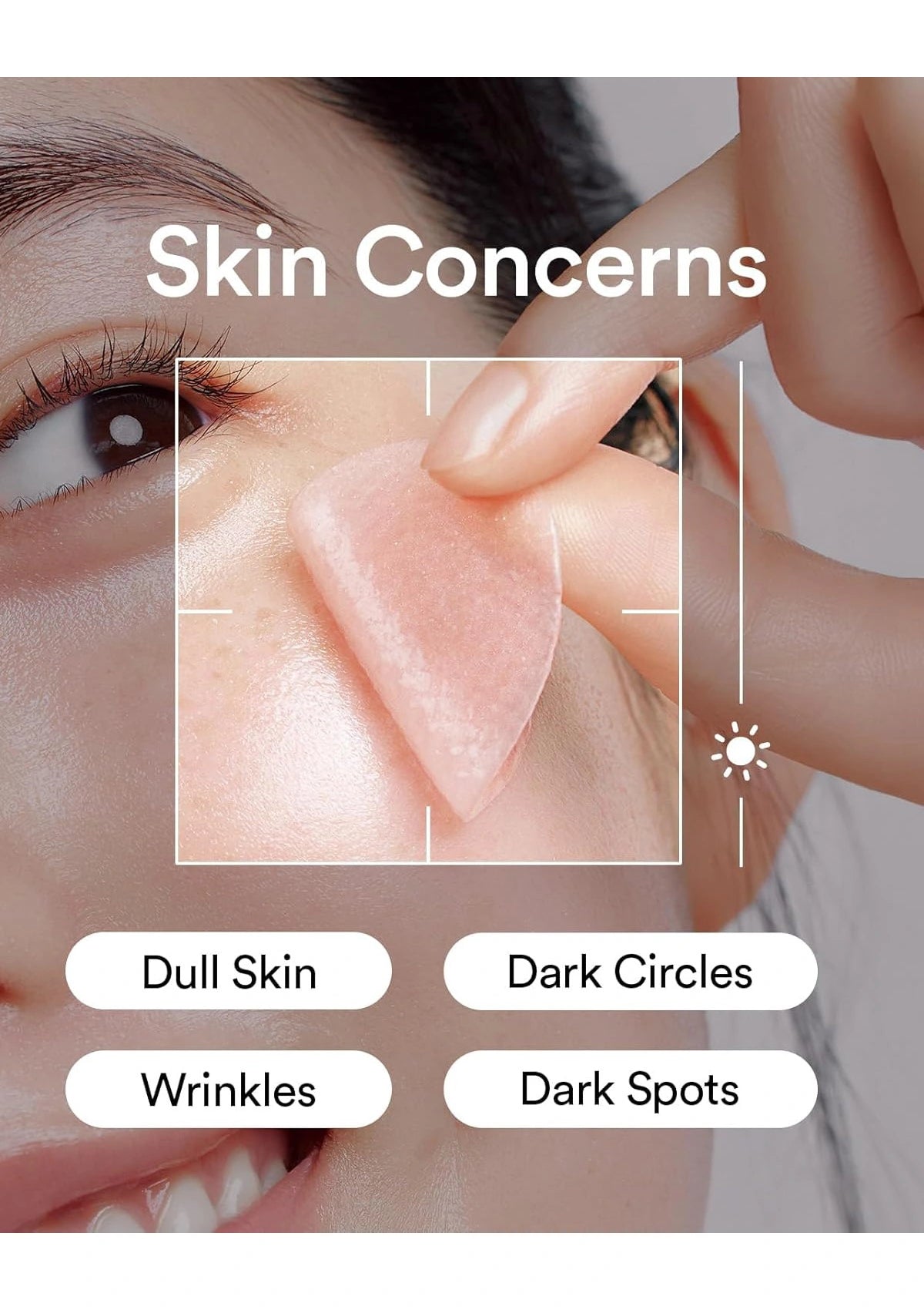 Close-up of a person's face with a hand applying a translucent pink skincare patch to the cheek. White text reads 'Skin Concerns' with labels below for 'Dull Skin', 'Dark Circles', 'Wrinkles', and 'Dark Spots'.