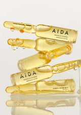 AIDA propolis calming ampoules on a light gray background