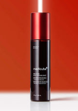 Medicube red body peeling shot bottle on a red background