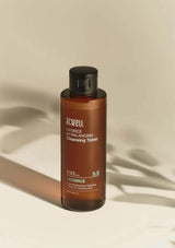 Brown bottle of ACWell Licoorice pH Balancing Cleansing Toner on a beige background