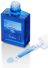 Blue serum bottle with applicator on a white background