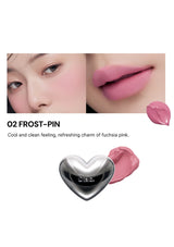 Lipstick with a heart-shaped cap on a white background, featuring a close-up of lips wearing the lipstick.