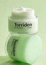 Torriden Balanceful Cream jar on a light green background