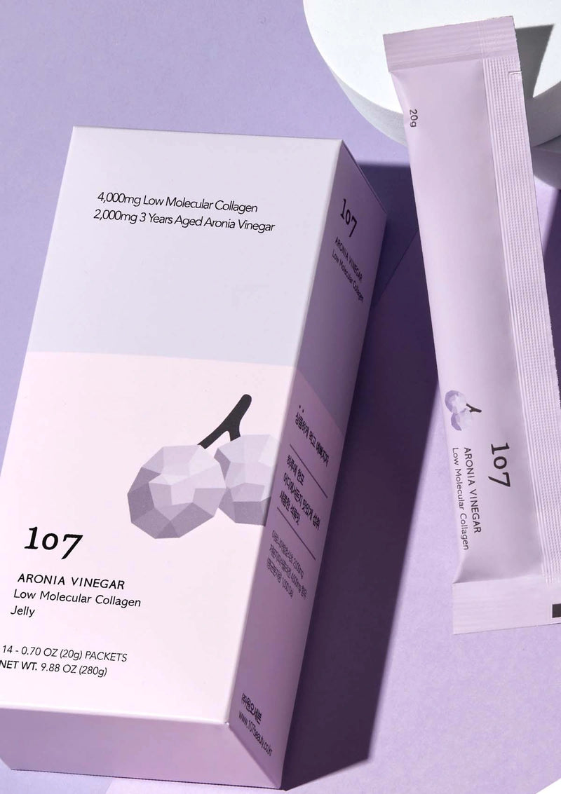 107 Aronia Vinegar Low Molecular Collagen Jelly packaging and packets on a purple background