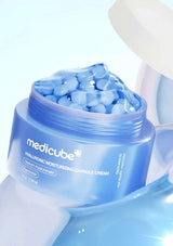 Medicube hyaluronic moisturizing capsule cream with blue capsules on a light blue background