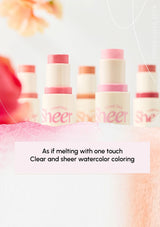 Cosmetic sticks with 'Sheer' text on a soft, blurred background