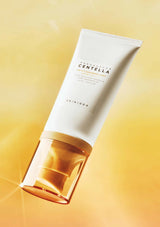 Skintouch Centella cleansing foam tube on a gradient yellow background