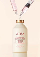 AIDA skincare bottle with droppers on a beige background