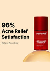 Red succinic acid serum bottle with 'medicube' branding on a beige background, featuring text about acne relief.