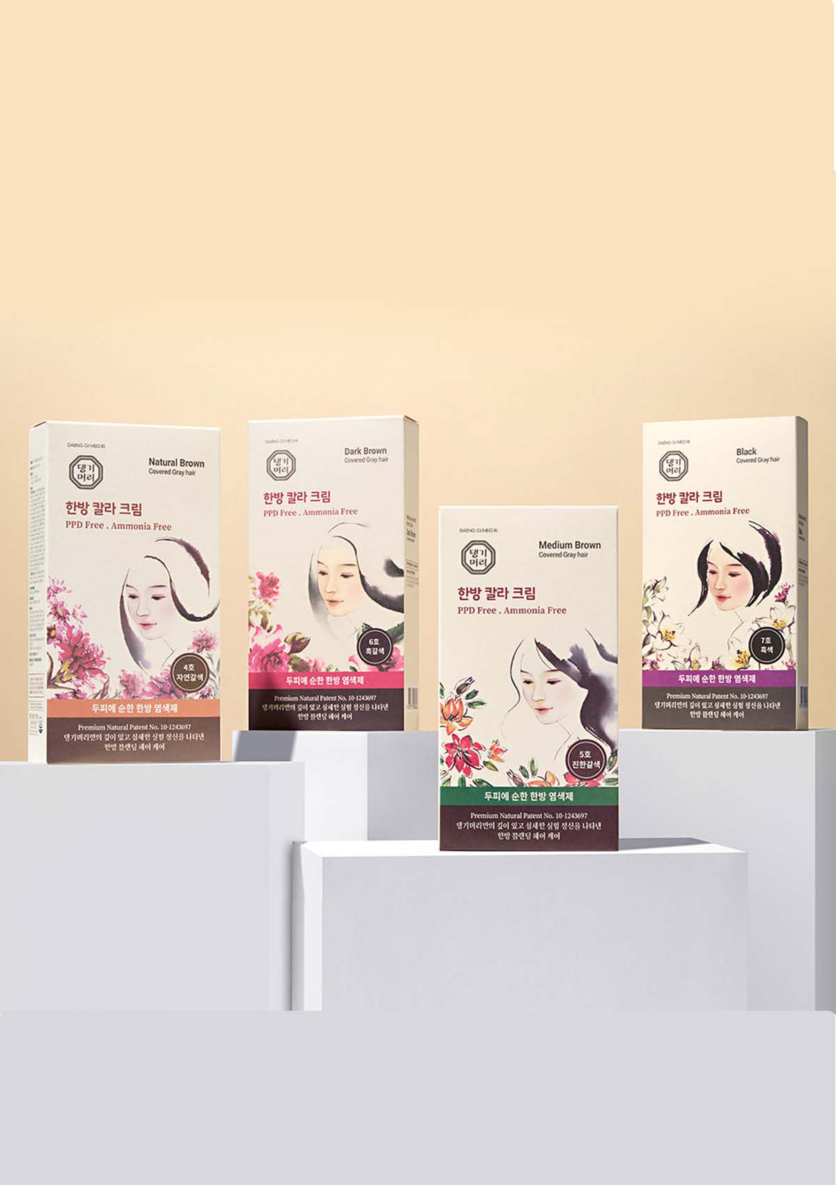 Set of facial mask packages on a white stand with a beige background
