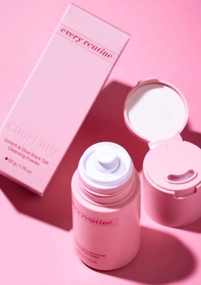 Pink skincare product with packaging on a pink background