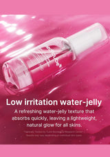 A clear pump bottle of red-cube water-jelly serum shown diagonally on a glossy pink background with white text below reading 'Low irritation water-jelly' and descriptive copy.