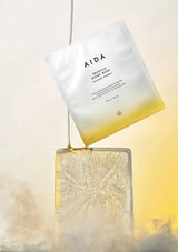 AIDA product packaging with a gradient design on a light background