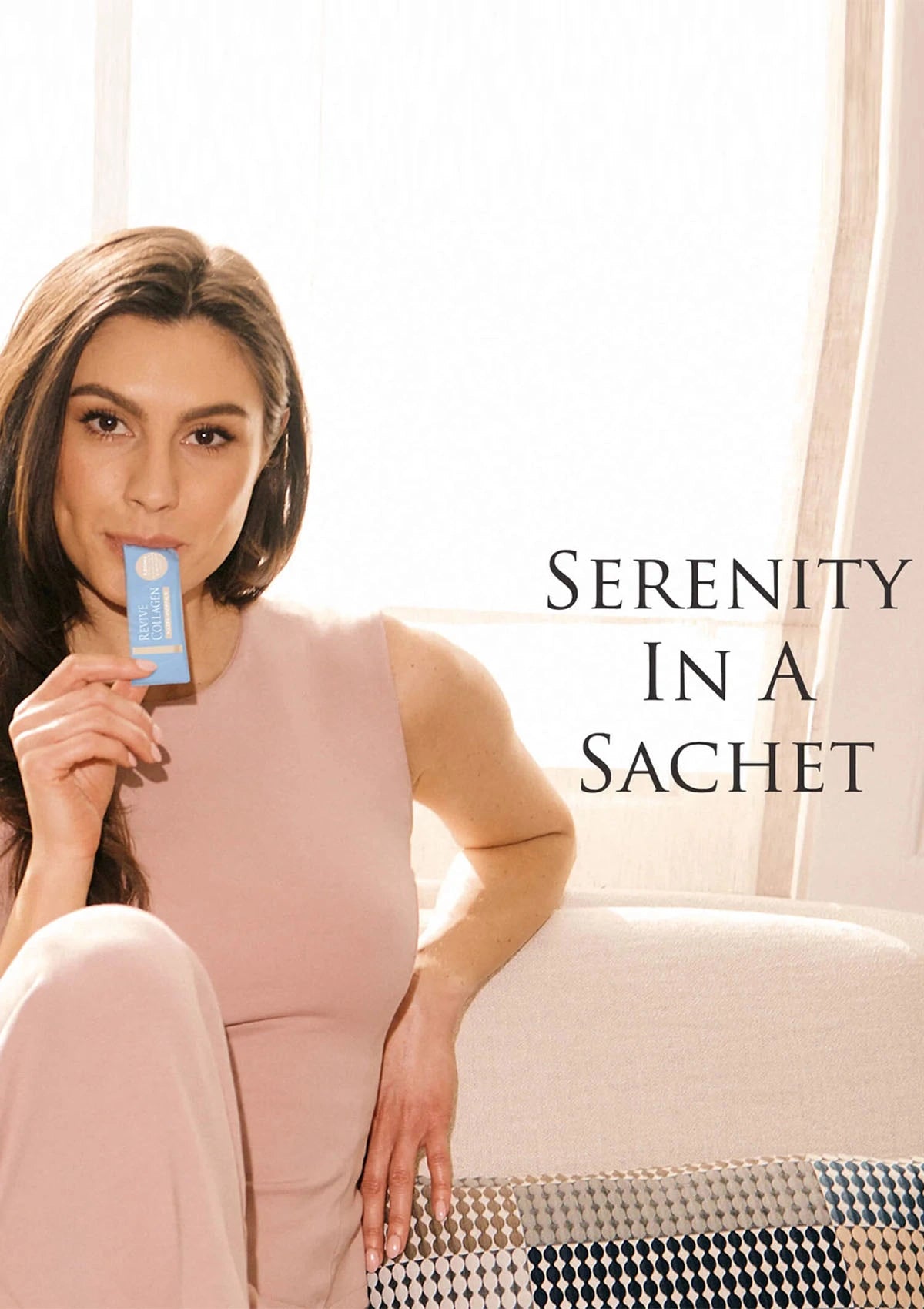 Woman holding a product with text 'Serenity in a Sachet' in a bright room.