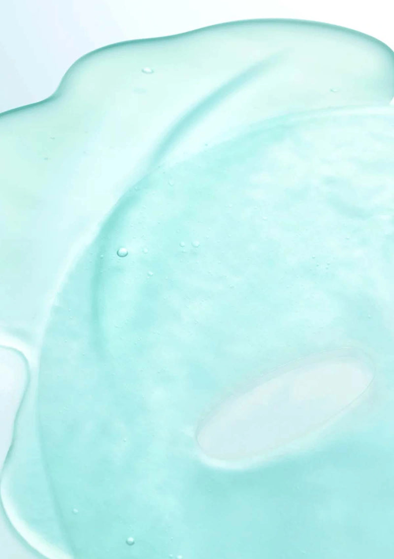 Close-up of a light blue, creamy substance on a white background