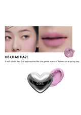 Lipstick with heart-shaped cap and close-up of lips wearing the shade '03 Lilac Haze'.