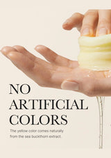 Hand holding a tube of cream with text about natural color from sea buckthorn extract.