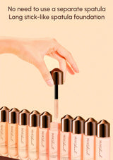 Hand using a long stick-like spatula to apply foundation from a MARSAL product, with text indicating no need for a separate spatula.