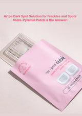 Pink packaging of Artpe dark spot solution patches with text on a light pink background
