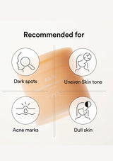 A skincare infographic on a light beige background with a soft peach-toned brush visible behind black line icons. Text reads 'Recommended for' and lists 'Dark spots,' 'Uneven Skin tone,' 'Acne marks,' and 'Dull skin.