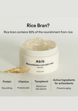 A jar of Abib Rice Probiotics Overnight Mask shown on a light gray background with text highlighting rice bran nutrients and ingredients. The white jar is open, showing a pale cream-colored mask, with a small sprig of rice bran placed beside it.