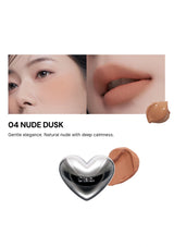 Lipstick with a heart-shaped cap on a white background, featuring close-up of lips and product.